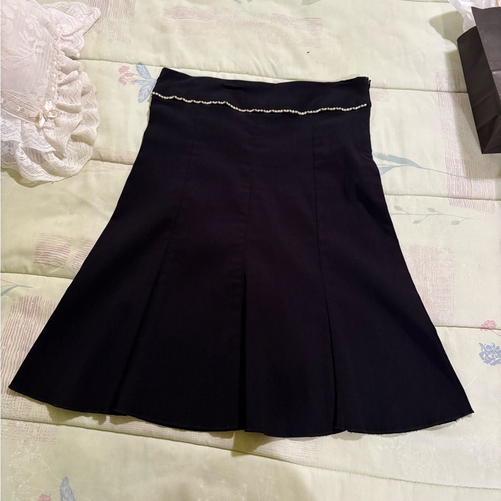 Woman’s black skirt
